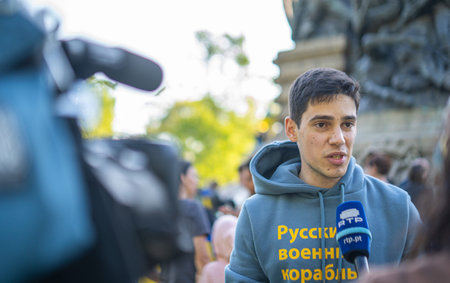 PORTO, PORTUGAL - 17.04.2022: A young Ukrainian male activist gives an interview to Portuguese televisionのeditorial素材
