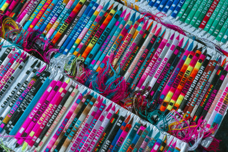 The stand with multicolored bracelets with the different names.