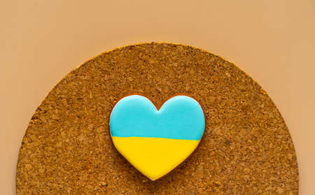 gingerbread heart shaped cookie with ukrainian flagの写真素材