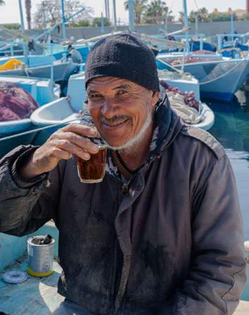 Hurghada, Egypt - February 21, 2022: Egyptian fisherman with teaのeditorial素材