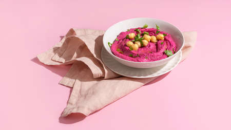 Beetroot hummus on pink backgroundの写真素材