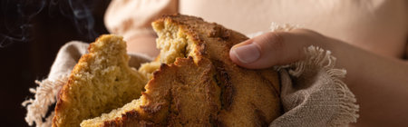 Female hands with fresh Corn Bread