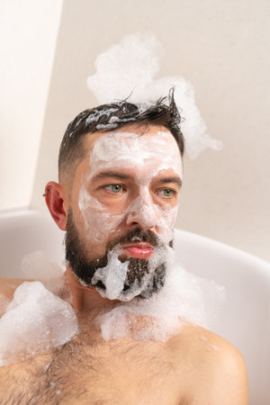 Fanny man with face mask in bath at homeの写真素材