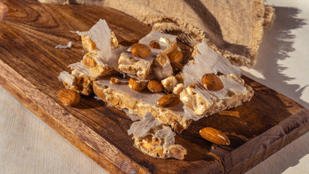 Almond turron dessert slices on wooden desk
