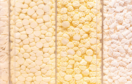 Pastel yellow marshmallows in a shop window