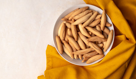 Spanish mini picos bread sticks in bowl top view