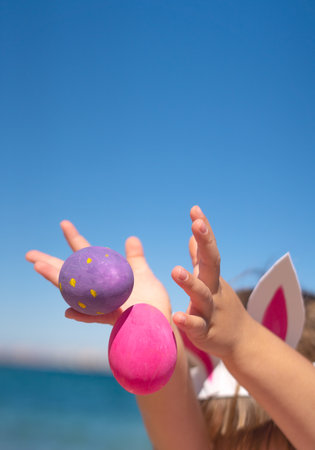Kids hands with easter eggsの写真素材
