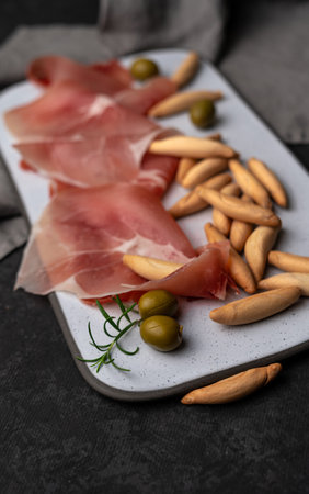 Spanish jamon and picos on deskの写真素材