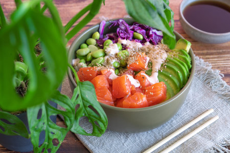poke bowl with salmon on the wooden table