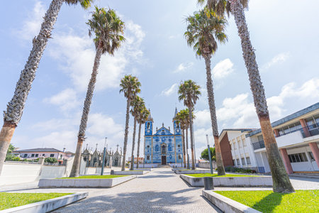 Blue tiled portuguese church with palm trees, Igreja Santa Maria de Cortegacaのeditorial素材