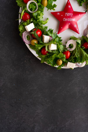 Christmas wreath salad on dark backgroundの写真素材