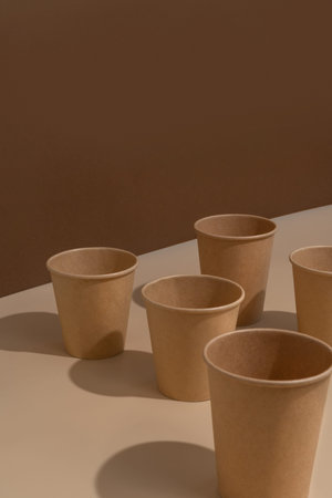 paper cups on a beige and brown background