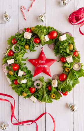 Christmas wreath salad on dark backgroundの写真素材
