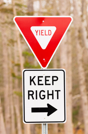 Yeild and keep right signage to prevent accidentsの写真素材