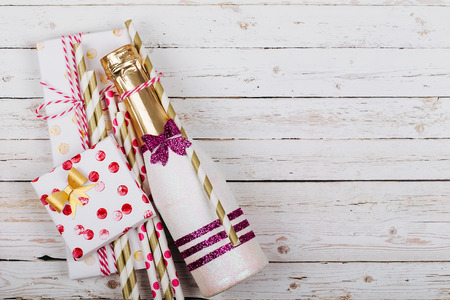 Mini glitter champagne and Christmas presentsの写真素材