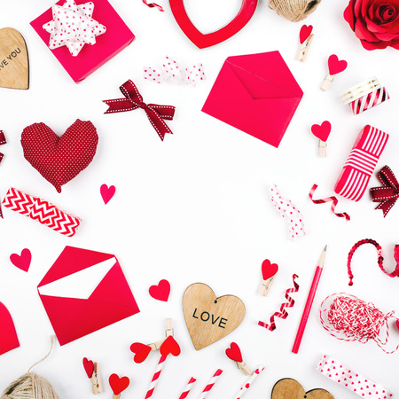 Romantic accessories composition. Frame made of red hearts and decoration の写真素材
