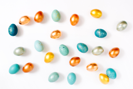 Pattern background  with  blue, gold and turquoise speckled easter eggs.  Ester conceptの写真素材