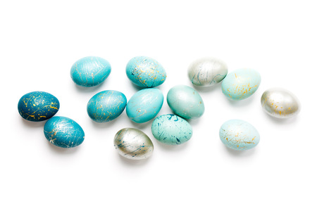 Stylish background of ombre blue Easter eggs isolated on white. Dyed Easter eggsの写真素材