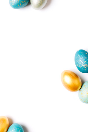 Frame background with  blue and turquoise speckled easter eggs  with copy space for text. isolated.  Ester conceptの写真素材
