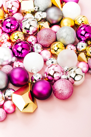 Holiday  arrangement with Stylish Christmas shiny baubles and gold crystals on pastel pink background. Flat lay, top viewの写真素材