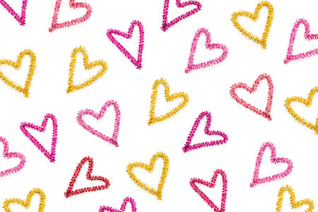Heart made of pink tinsel. Love and heart symbols. Flat lay, top view