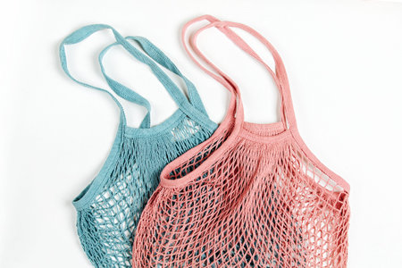 Cotton net bag on white background. Zero waste concept. Sustainable lifestyle.