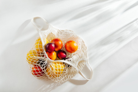 Cotton net bag with fruits. Sustainable lifestyle.  Eco friendly concept.の写真素材