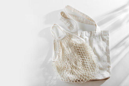 Reusable shopping bags on white background. Zero waste concept. No plastic.
