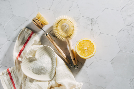Natural cleaning products lemon and baking soda with bamboo dish brushs. Eco friendly. Zero waste concept. Plastic free.の写真素材