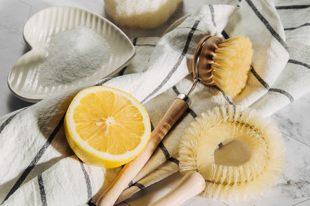 Natural cleaning products lemon and baking soda with bamboo dish brushs. Eco friendly. Zero waste concept. Plastic free.の写真素材