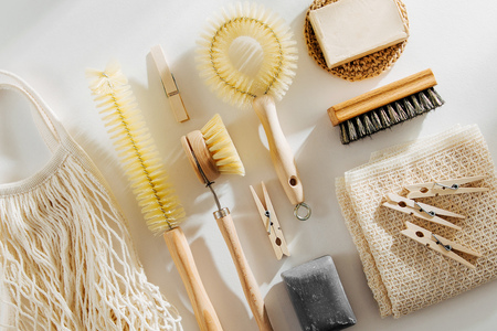 Zero waste, compostable cleaning tools. Wooden dish brush, clothespins, soap and mesh market bag . Eco friendly concept.の写真素材