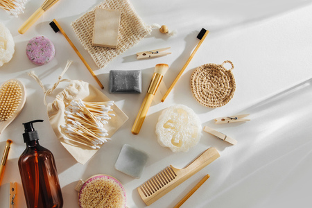 Set of Eco cosmetics products and tools. Soap, Shampoo Bottles, bamboo toothbrush, natural wooden brush. Zero waste, Plastic free. Sustainable lifestyle concept.の写真素材