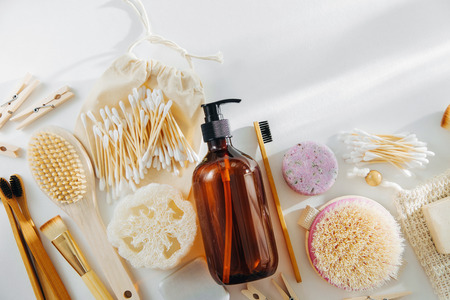 Zero waste supplies for personal hygiene. Eco Soap, Shampoo Bottles, bamboo toothbrush, natural wooden brush. Sustainable lifestyle. Plastic free concept.の写真素材