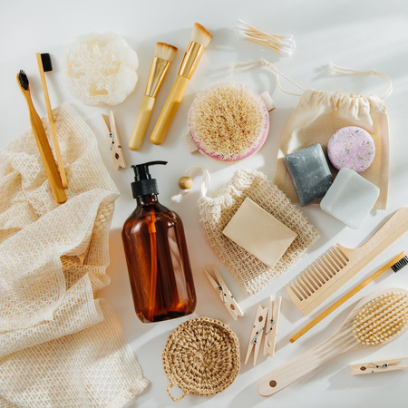 Set of Eco cosmetics products and tools. Soap, Shampoo Bottles, bamboo toothbrush, natural wooden brush. Zero waste, Plastic free. Sustainable lifestyle concept.の写真素材