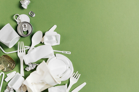 Plastic waste collection on  green background. Concept of Recycling plastic and ecology. Flat lay, top viewの写真素材