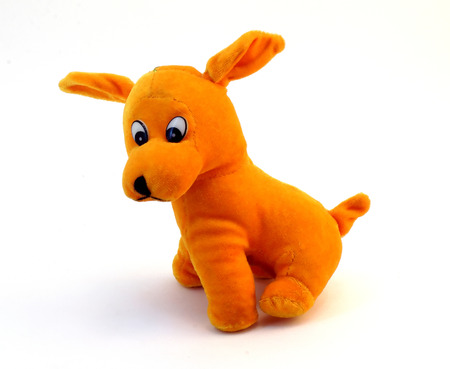 soft toy - orange dog with long ears isolated on white backgroundの写真素材