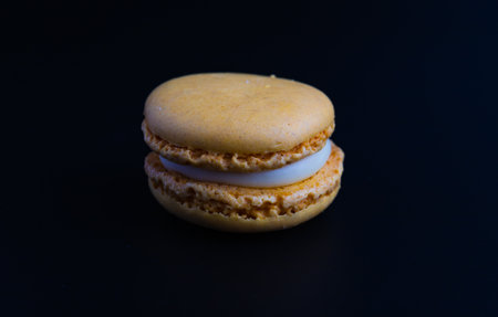 Colorful macarons on a black background, isolatedの写真素材
