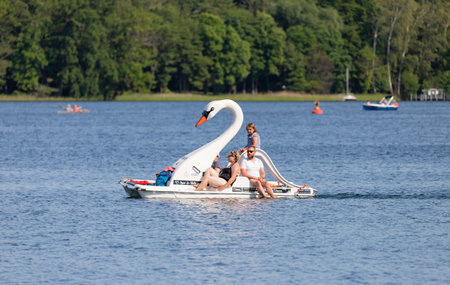 Bad Saarow, Germany - June 4, 2023, driving with the family in the swan boat on the lake in the best weather.のeditorial素材