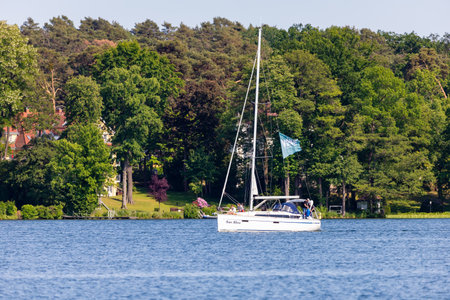 Bad Saarow, Germany - June 4, 2023, Spend a nice day with the family in the best weather on the lake with a sailing boat.のeditorial素材