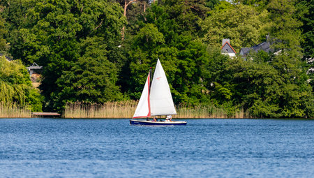 Bad Saarow, Germany - June 4, 2023, Spend a nice day with the family in the best weather on the lake with a sailing boat, copy space.のeditorial素材