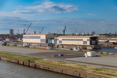 Hamburg, Germany-July 15, 2023, View of the city of Hamburg with part of the port from the water. Industrial port part.のeditorial素材