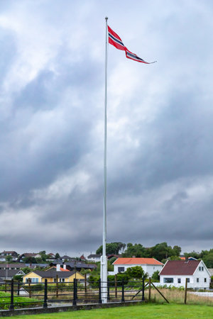 Norwegian triangular pennant flag on high pole blowing in the wind.の写真素材