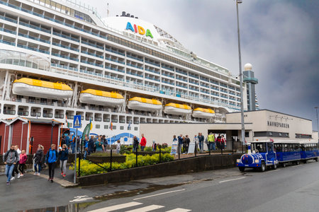 Haugesund, Norway - July 17, 2023: Cruise ship dock in Haugesund. It was developed with AIDAPrima. People go in and out of their excursion collection points.のeditorial素材