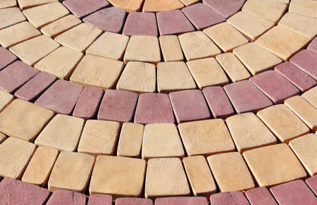terrace of yellow and red stone paved radial