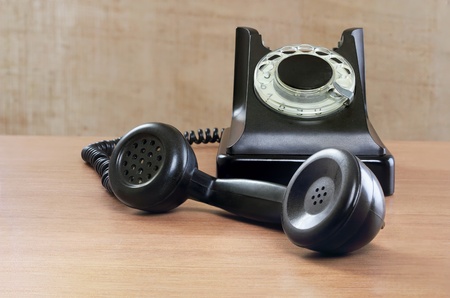 Still-life with old phone on a beige backgroundの写真素材