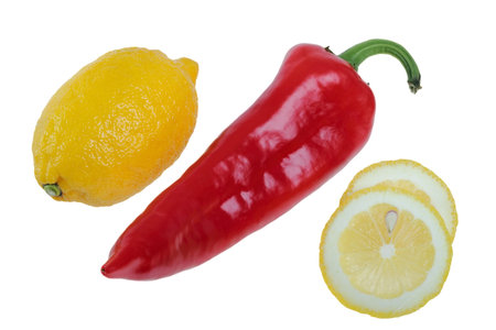 Lemon and piece of a lemon with the red pepper, isolated on the white
