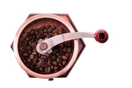 old wooden worm eaten coffee mill isolated on a white backgroundの写真素材