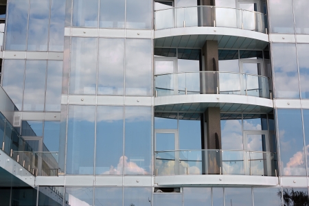 Sky reflection in the glass windows of high-rise buildingsの写真素材