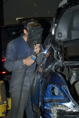 Welding the car body after the accidentの写真素材