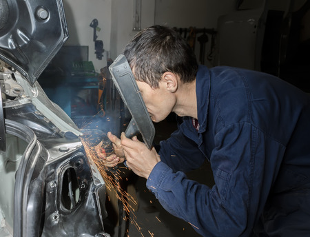 Welding the car body after the accidentの写真素材